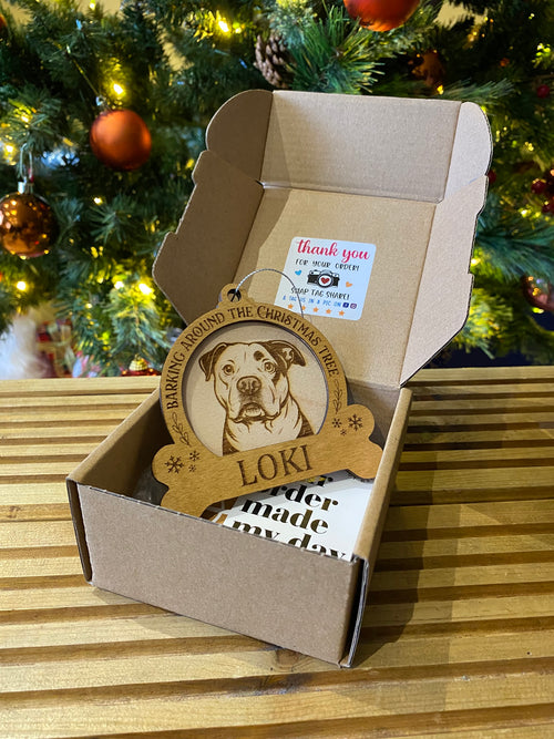 Personalised wooden Christmas dog bauble with engraved pet portrait and name